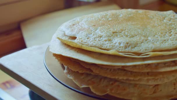 Yellow delicious pancake stack on brown plate. Home cooking. Slowmo. Side view. — Stock Video