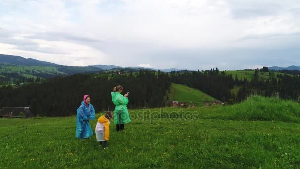 Family wearing raincoats — Stock Video