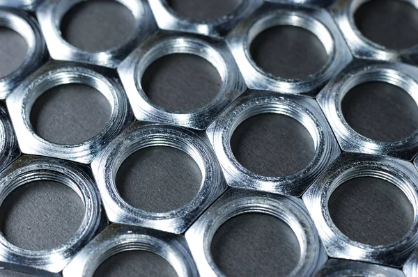 Boční pohled close-up chrom kovové matice — Stock fotografie