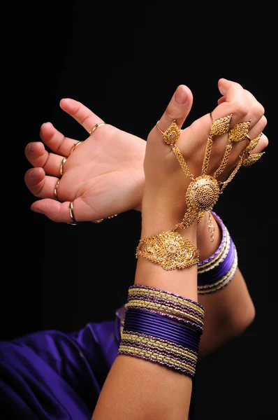 Female hands in movement of national indian dance