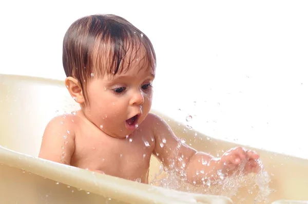 Little baby girl play with splashes water — Stock Photo, Image