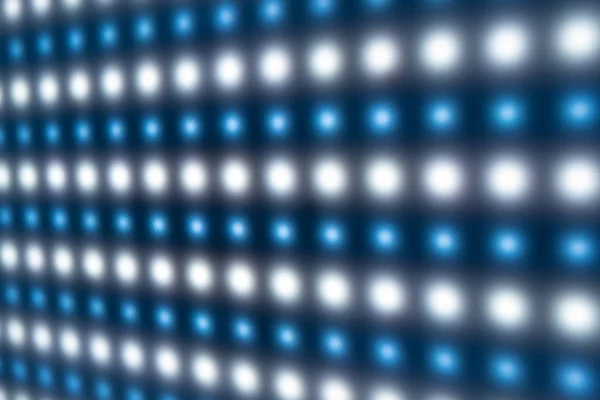 Defocused close-up of panel with bright luminous LEDs — Stock Photo, Image