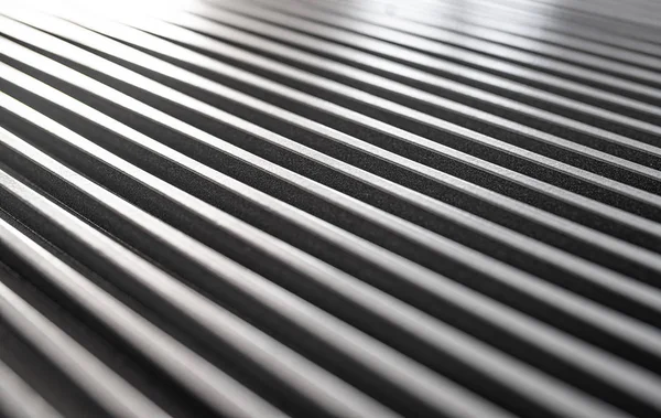 Primo piano di una superficie ondulata di ferro di un dispositivo — Foto Stock