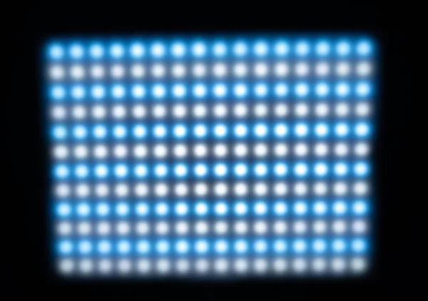 Large panel with defocused bright cold blurry lights