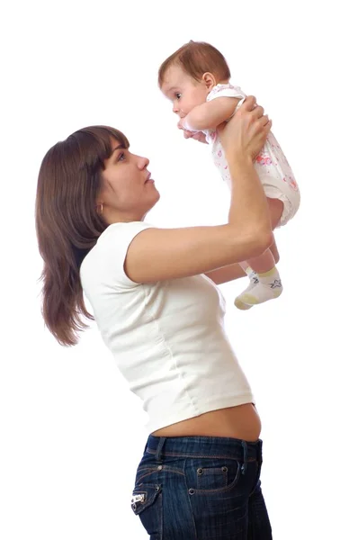 Standing woman holding baby on hands above head — Stock Photo, Image