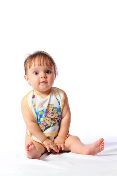 Gelukkig een jaar baby zit met slabbetje — Stockfoto