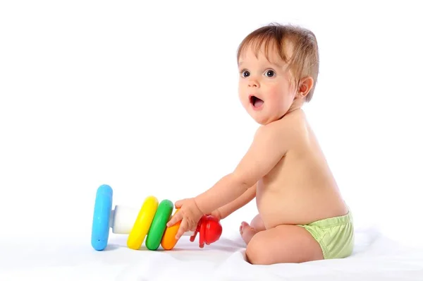 Little baby playing with pyramid toy — Stock Photo, Image