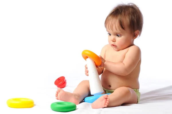 Happy child plays with toy — Stock Photo, Image