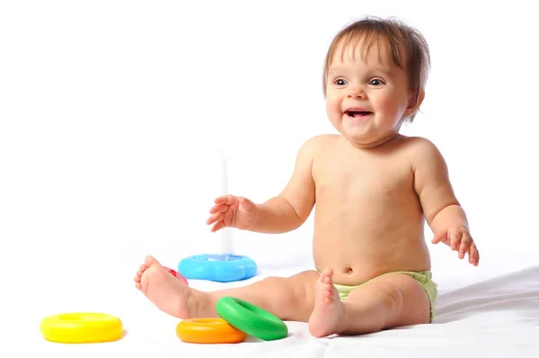 Happy child plays with toy — Stock Photo, Image