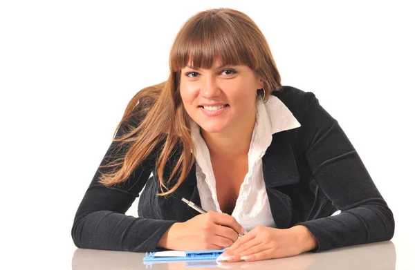 Vrouw noteert in notitieboek — Stockfoto