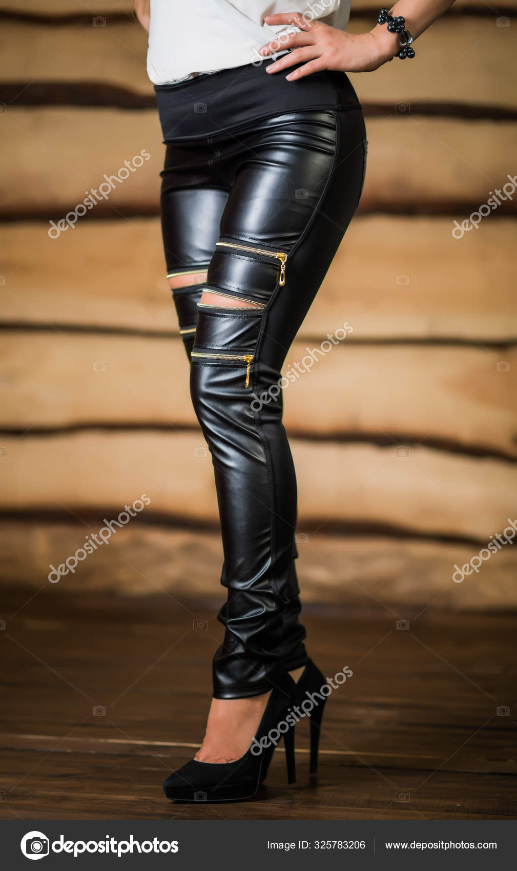 Beautiful young woman in ripped leggings Stock Photo by  ©YouraPechkin@gmail.com 325783206