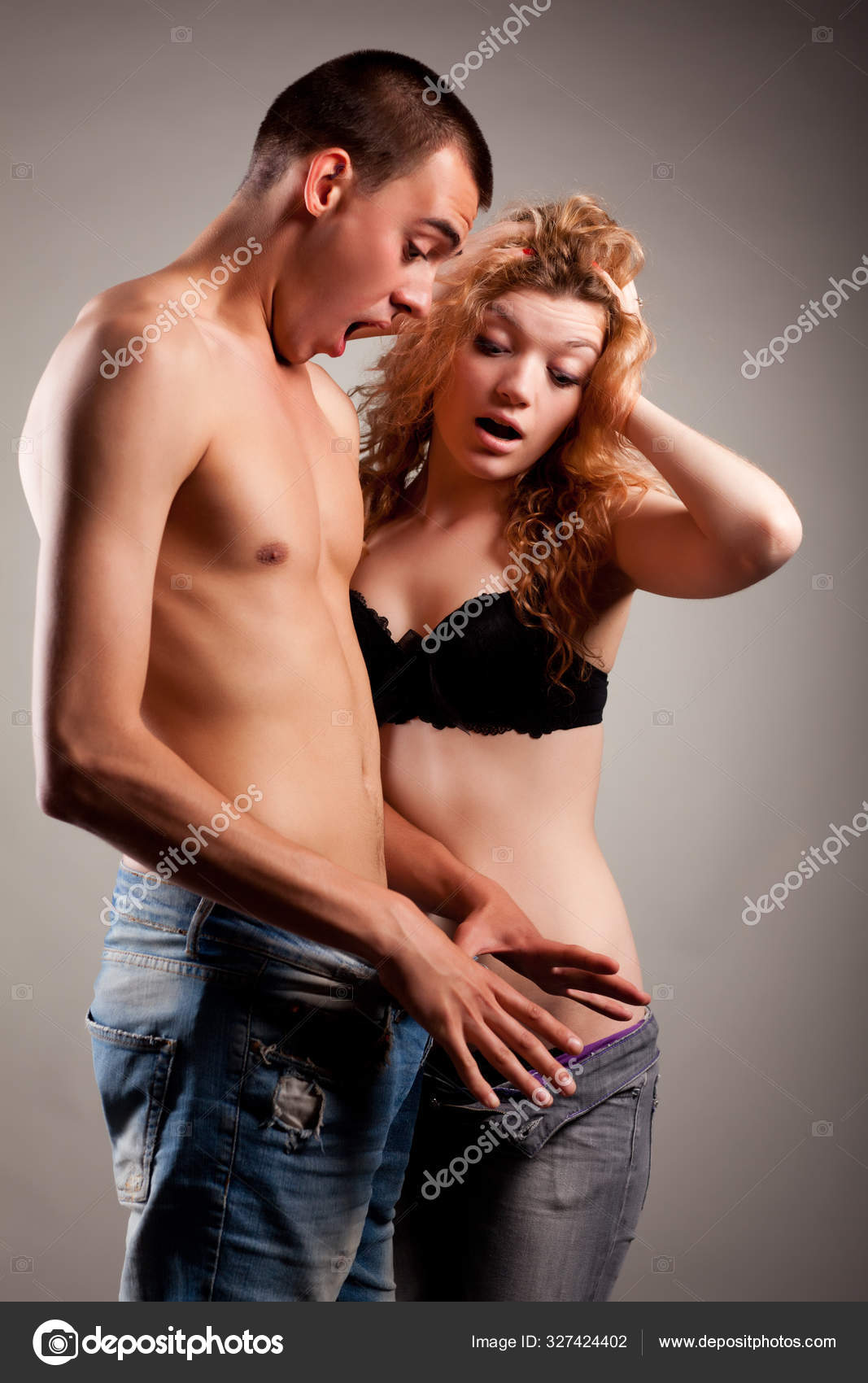 Half-naked sexually arousedl couple looking inside of mans jeans and ready for sex Stock Photo by ©YouraPechkin@gmail 327424402 picture
