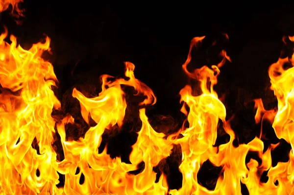 Burning fire on black background — Stock Photo, Image