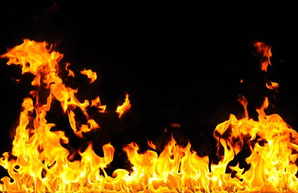 Abstract fire burns on dark background — Stock Photo, Image