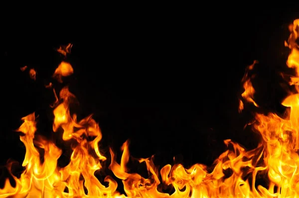 Fire tongues on black background — Stock Photo, Image