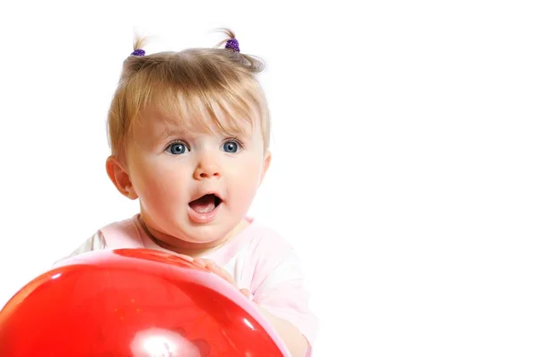 Little girl holding red balloon — ストック写真