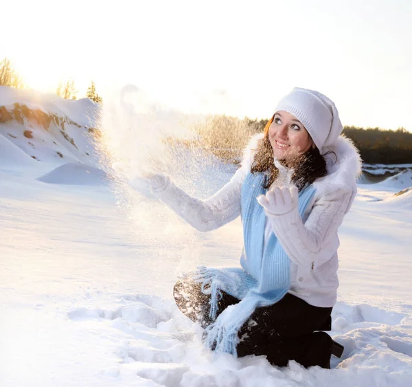 Girl with closed eyes throws up snow — 스톡 사진