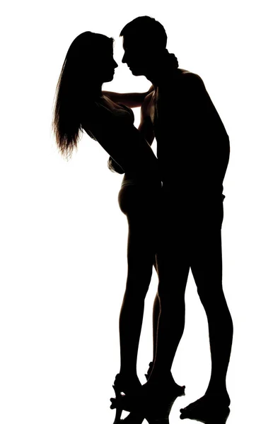 Silhouet van knuffelen paar op witte achtergrond — Stockfoto
