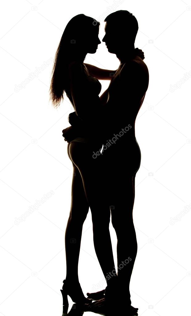Silhouette of hugging couple on white background