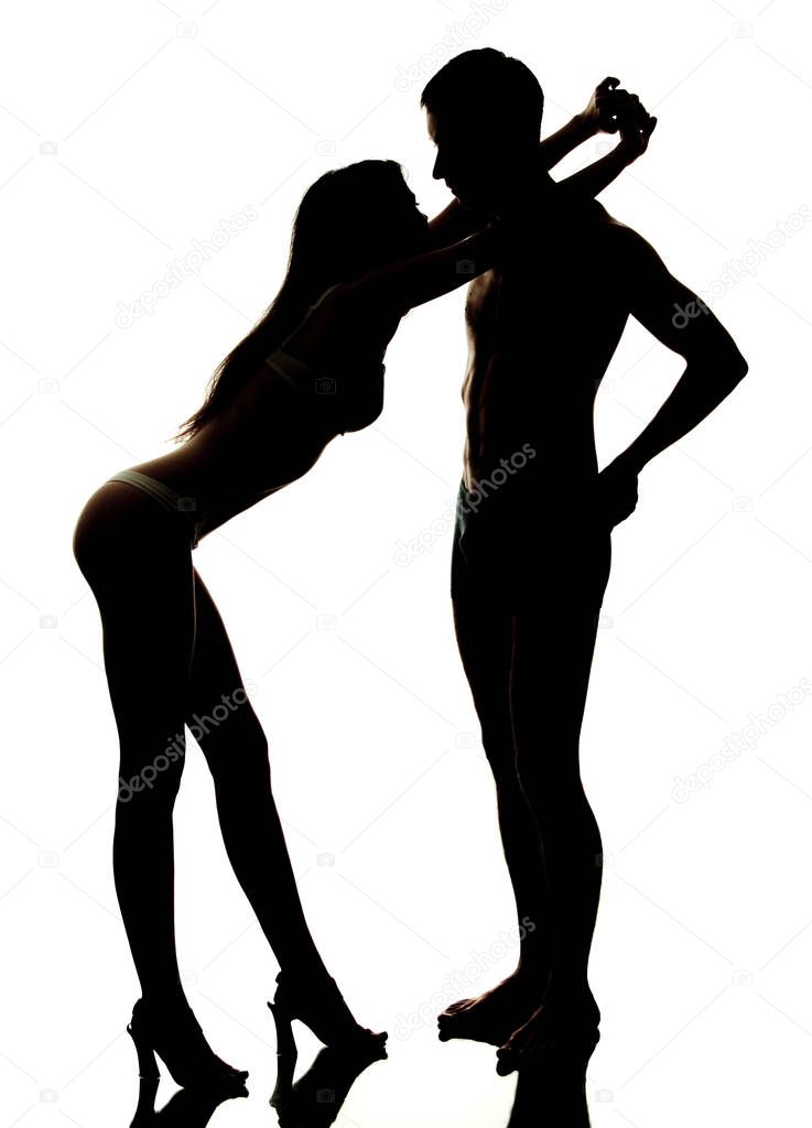 Dark silhouette of couple on white background