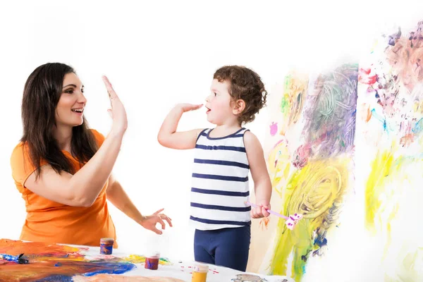 Happy girl and little boy give high five — 스톡 사진