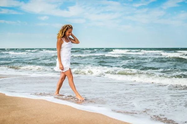 Charming young woman in a white dress — 스톡 사진