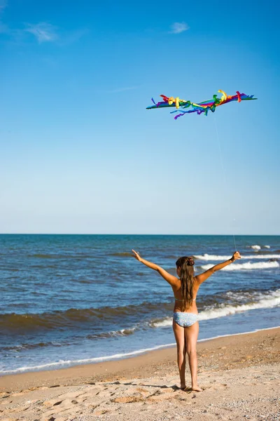 Two little happy cheerful girl run with a kite — 스톡 사진