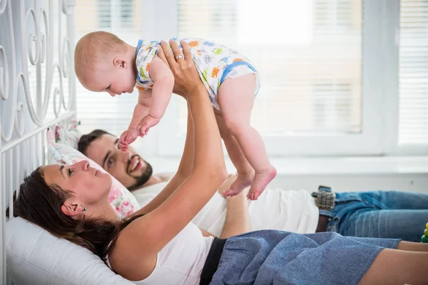 Side view of happy young parents — 스톡 사진