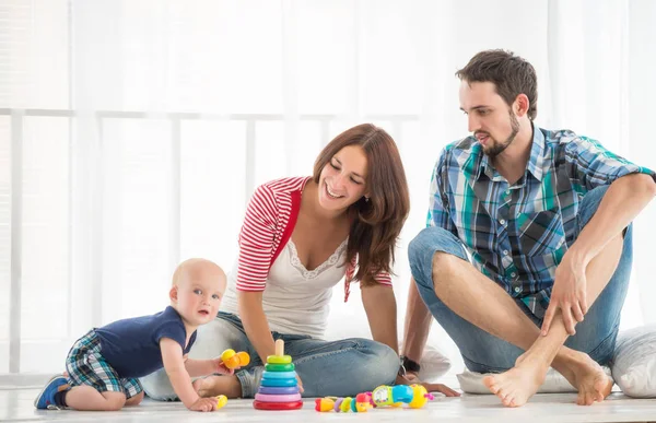 Young positive family, mom, dad and son Stock Photo