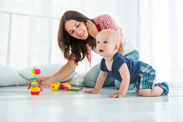 Charming cute cheerful boy with a happy caring mom Stock Picture