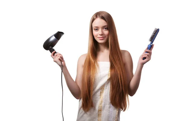 Girl in white towel drying hair with hairdryer — 스톡 사진