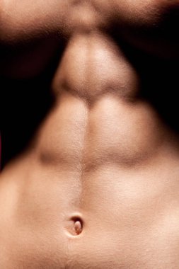 Closeup of sporty belly of woman