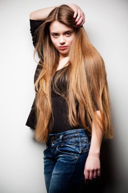 Woman dressed in black jacket and long hair
