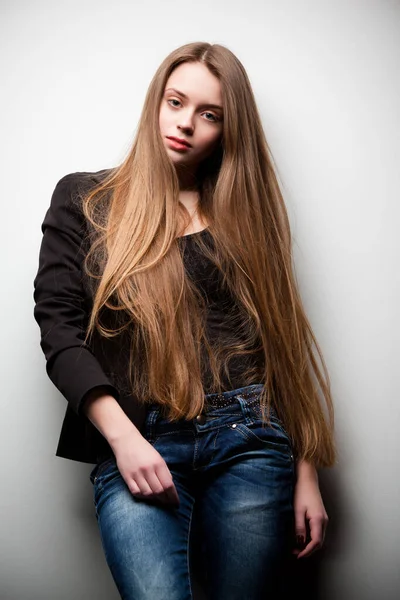 Woman dressed in black jacket and long hair — Stock Photo, Image