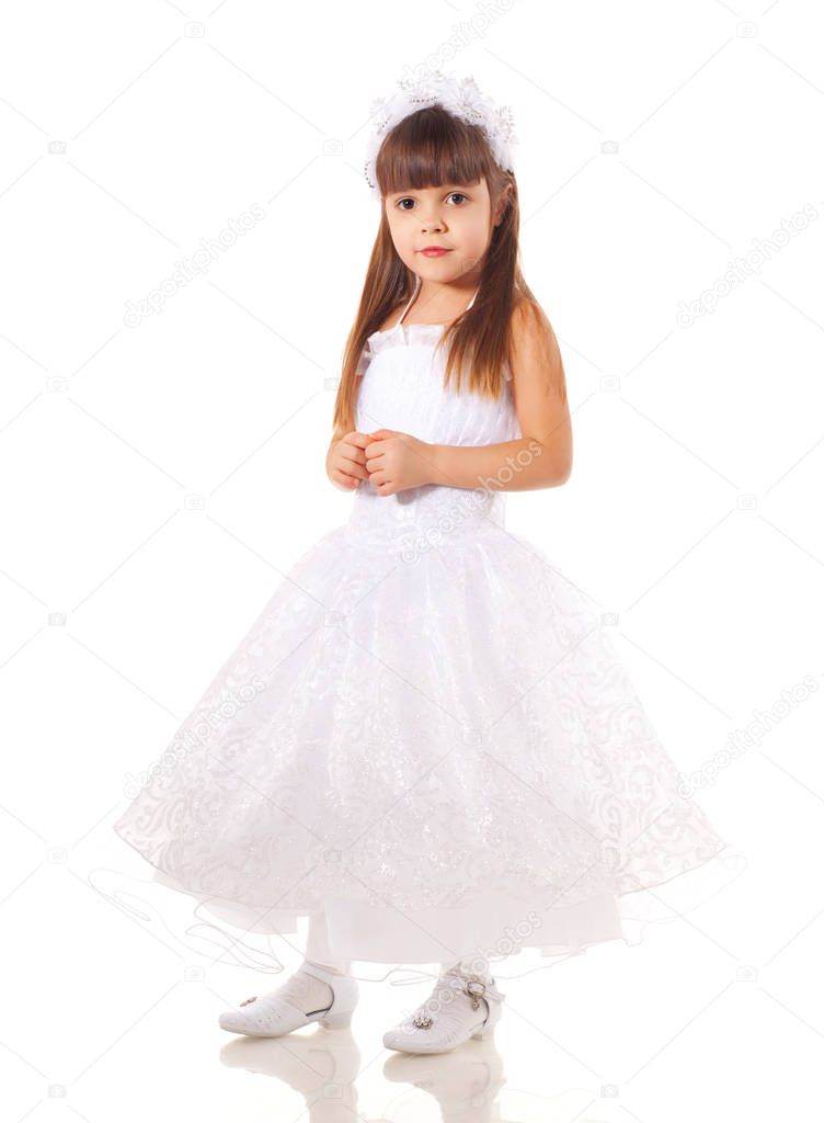 Girl dressed in white dress on white background