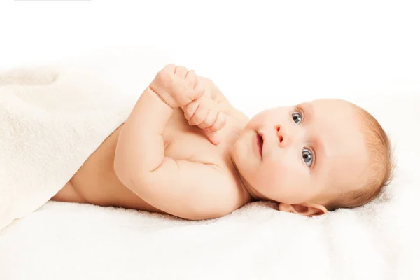 Adorable baby lying on white sheets. — 스톡 사진