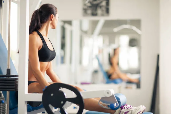 Woman with gym stick on fitness equipment Stock Photo by YouraPechkin