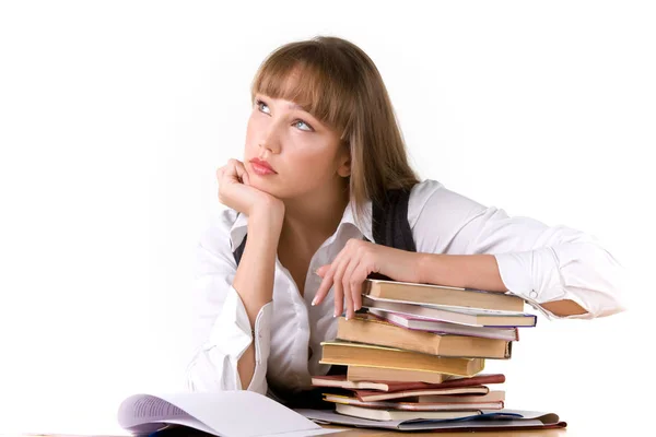 Pensive young girl student looks up Royalty Free Stock Photos