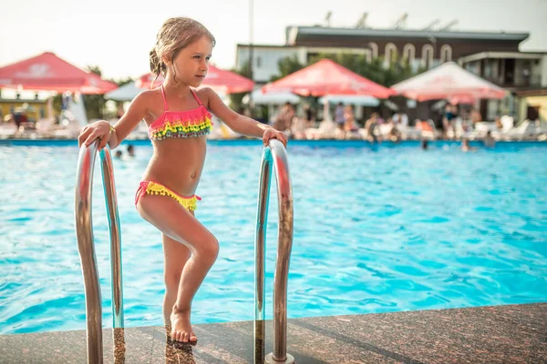 Happy Little Pretty Girl Colored Bathing Suit Leaves Pool Holding — 스톡 사진