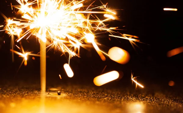 Close Golden Blurry Sparks Burn Dark Light Festive Candles Concept — Stock Photo, Image