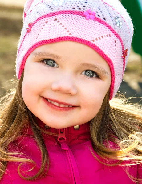 Portrait of happy cute little girl on a spring day — Stock Photo, Image