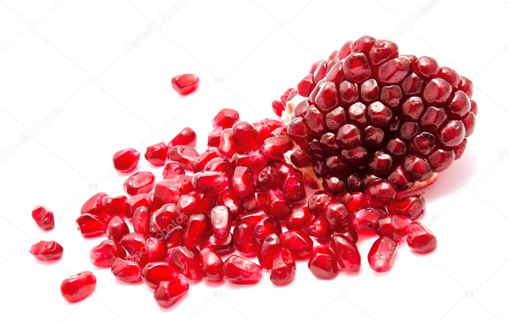 Ripe pomegranate fruit seeds isolated on a white