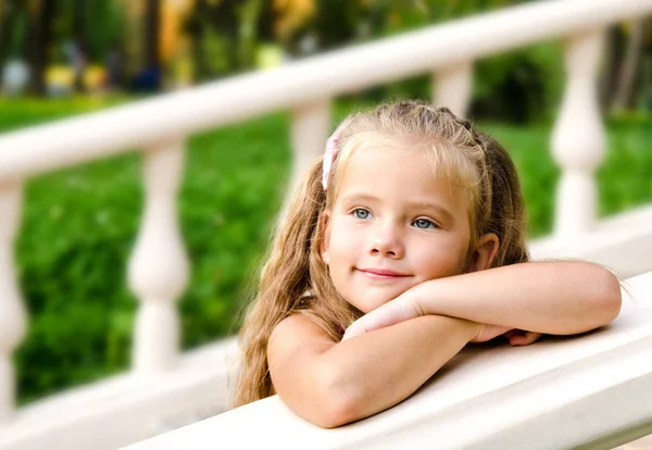 Portrait of adorable little girl in the park — Stock Photo, Image