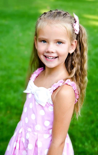 Portrait of adorable little girl in the park — Stock Photo, Image