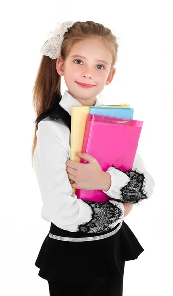 Retrato de niña de la escuela sonriente feliz con libros en unifor — Foto de Stock