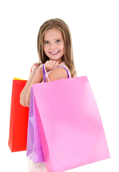 Adorable niña pequeña sosteniendo compras coloridas bolsas de papel —  Fotos de Stock