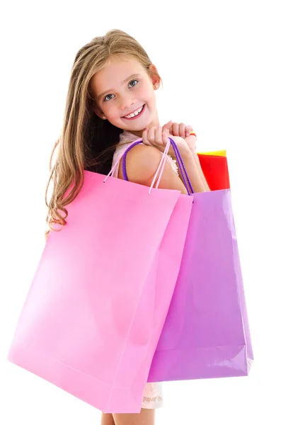 Bedårande liten flicka barn hålla matkassar eller färgglada papper — Stockfoto