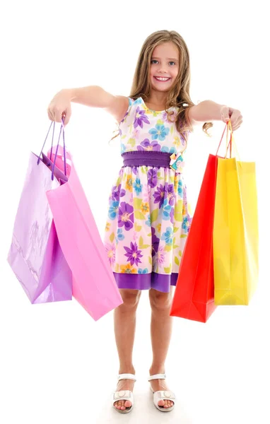 Adorable niña pequeña sosteniendo compras coloridas bolsas de papel —  Fotos de Stock