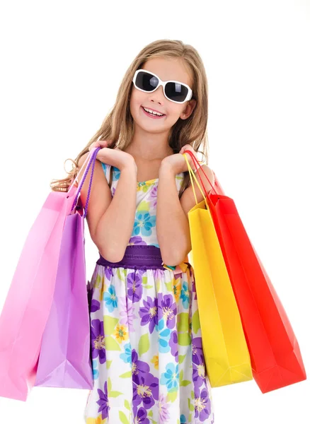 Adorable niña niña en gafas de sol celebración de compras colorf —  Fotos de Stock