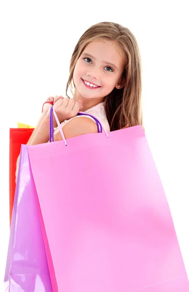 Adorable niña pequeña sosteniendo compras coloridas bolsas de papel —  Fotos de Stock